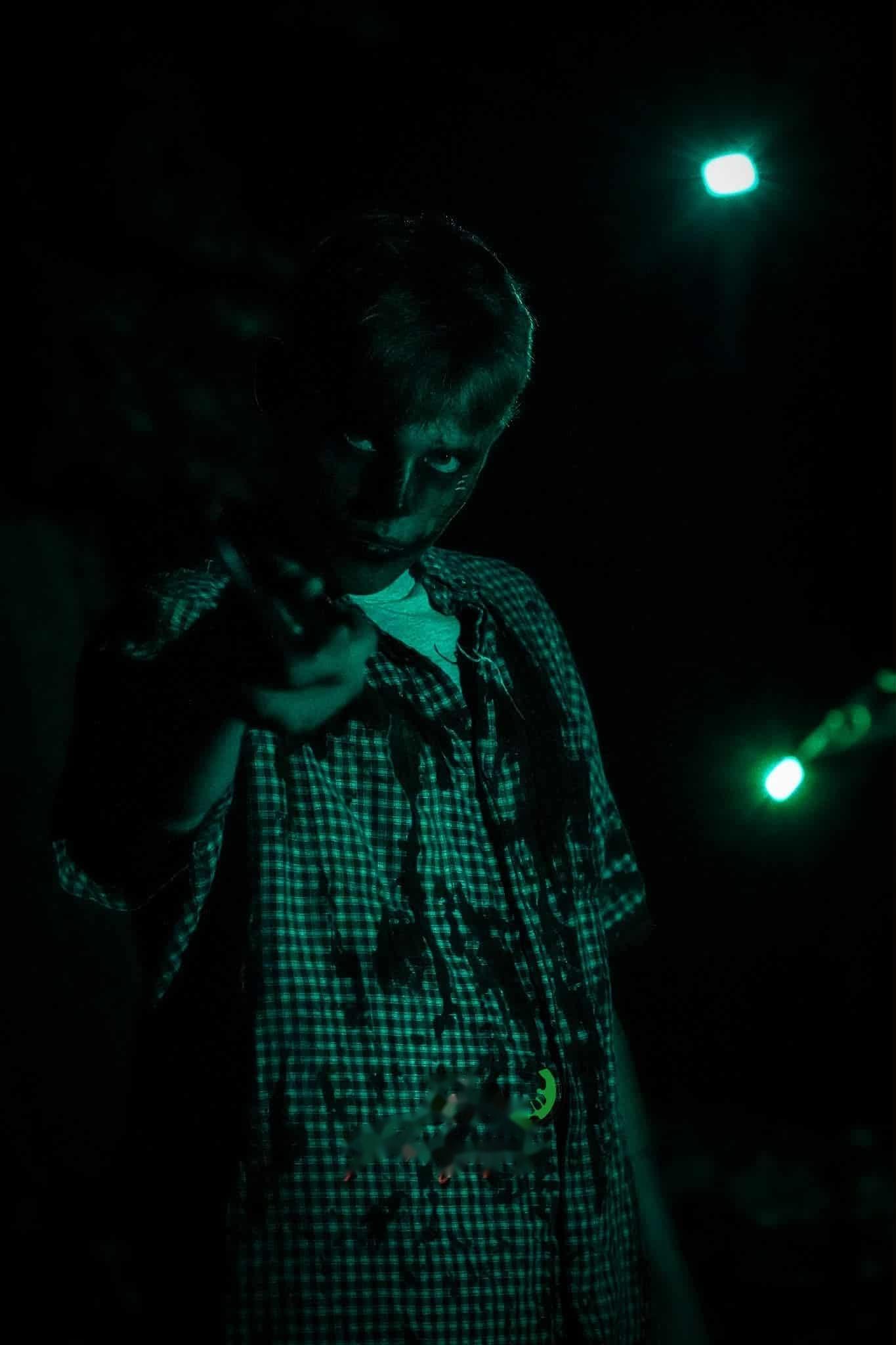 A crowned character under blue light